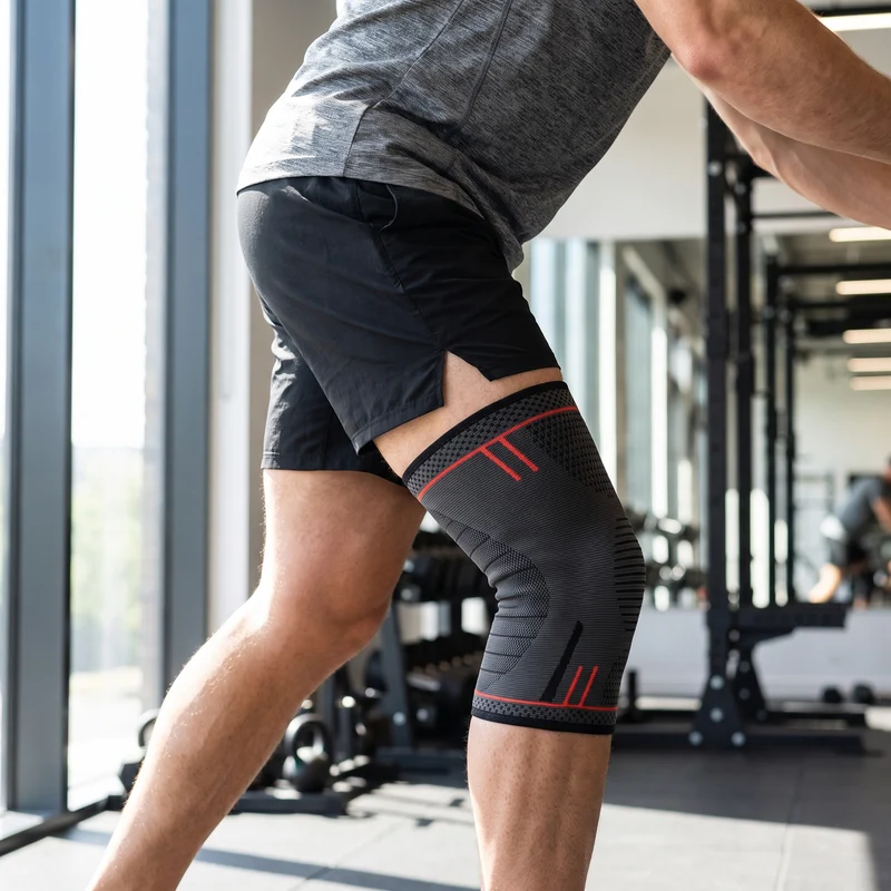 Genouillère de Compression Sangle Rotule - Noir & Rouge
